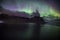 Aurora Borealis on display at the iconic Vestrahorn mountain in Stokksnes, East Iceland