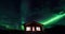 Aurora borealis (Northern Lights) above cabins