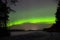 Aurora Borealis, Northern Lights above frozen river