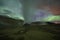 Aurora Borealis (Northern Lights) above geothermal volcanic vents in Hveravellir