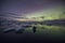 Aurora Borealis Northern Lights above Jokulsarlon Glacier Lagoon with photographer