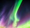 Aurora Borealis or Northern lights green and purple colors with starry in night sky