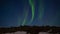 Aurora borealis. Northern lights in Iceland. Real night sky with stars in time lapse.