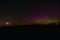 Aurora Borealis Northern Lights over a cemetery on a clear night in Wisconsin