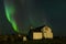 Aurora Borealis with old house