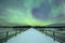 Aurora borealis over a bridge in winter, Finnish Lapland