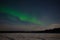 Aurora Borealis over the frozen Imandra Lake. Khibiny, Kola Peninsula. Russia