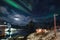 Aurora borealis over Hamnoy village with bridge at Lofoten islands