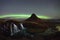 Aurora Borealis over Kirkjufellsfoss and Kirkjufell mountain