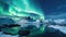 Aurora borealis over the sea, snowy mountains and city lights at night. Northern lights in Lofoten islands, Norway. Starry sky