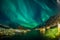 Aurora borealis over Tromso boat docks