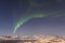 Aurora borealis over Tromso seen from Floya hill