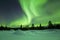 Aurora borealis over winter landscape, Finnish Lapland