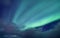 Aurora Borealis, Senja Islands, Norway. Stars, moving clouds and northern light. Night landscape. Natural background.