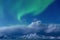 Aurora borealis, Tronso, Norway.  Green northern lights over Fjord And Mountains,  Night winter landscape with Starry sky and