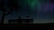 Aurora Couple sitting on the bench northern light Happy family Social distancing