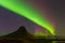 Aurora dancing over Kirkjufell mountain with fully of start night view