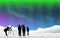 Aurora Northern Lights with Snow at Night silhouette people looking at stars