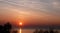 Auroral sky and chemtrail above Lake Balaton