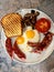 Aussie / Australian Breakfast with Brioche Toast, Fried Eggs, Crispy Bacon Sausage and Mushrooms