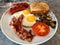 Aussie / Australian Breakfast with Brioche Toast, Fried Eggs, Crispy Bacon Sausage and Mushrooms