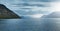 The austere Icelandic landscape with the mountains and the fjords in the background