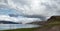 The austere Icelandic landscape with the mountains and the fjords in the background