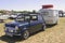 Austin mini small towing a caravan with its measurement