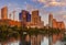 Austin, Texas with new buildings rising, reflecting in Lady Bird Lake at sunset / Austin Skyline and new constructions