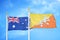 Australia and Bhutan two flags on flagpoles and blue cloudy sky