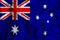 Australia flag in the background Conceptual illustration and silhouette of a high voltage power line in the foreground a symbol of