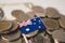 Australia flag on coins background, finance and accounting, banking.