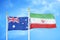 Australia and Iran two flags on flagpoles and blue cloudy sky