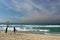 Australia: Tamarama beach lifeguard and woman surfer