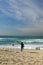 Australia: Tamarama beach woman surfer pointing