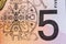 Australian 5 dollar bill fragment closeup showing the Parliament