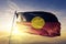 Australian Aboriginal flag textile cloth fabric waving on the top sunrise mist fog