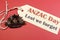 Australian ANZAC Day WW1 Rising Sun Hat Badge with Lest We Forget message