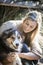 Australian Beauty with Long Blond Hair sits with her collie dog.