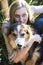 Australian Beauty with Long Blond Hair sits with her collie dog.