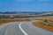 Australian bush road curving through dry landscape