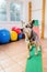 Australian Cattledog sits on a seesaw