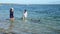 Australian Department of Parks and Wildlife ranger and volunteer feeding dolphins