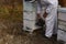 Australian farmer tending his bee hives