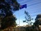 Australian flag flying on pole in front of residential home