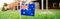 Australian flag on green grass in front of house. Australia day national holiday celebration. Nature background with Aussie symbol