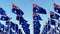 Australian flags waving in the wind against blue sky.
