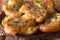 Australian food: crash hot potatoes with thyme on a plate close-up. horizontal