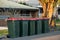 Australian garbage wheelie bins with colourful lids for general household waste on the street kerbside for council rubbish