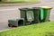 Australian garbage wheelie bins with colourful lids for recycling and general household waste